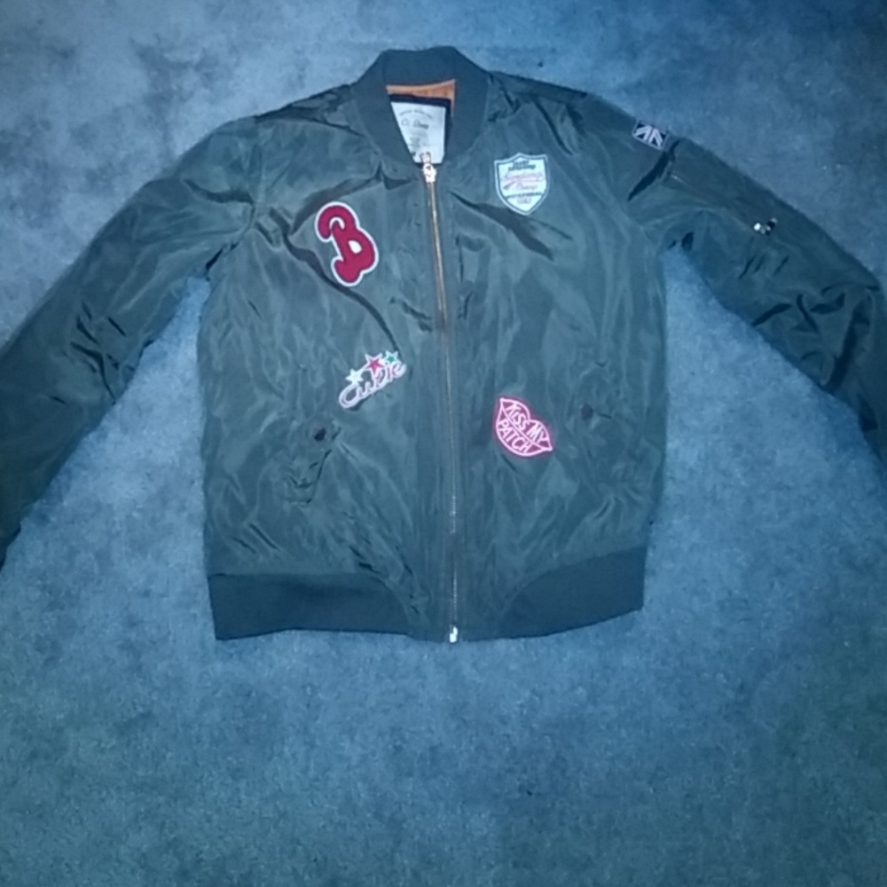 Olive green bomber jacket with patches